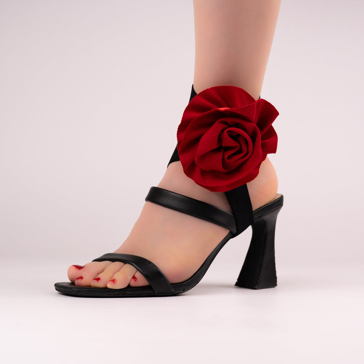 Red rose LYNKS straps styled on a black open-toe block heel
