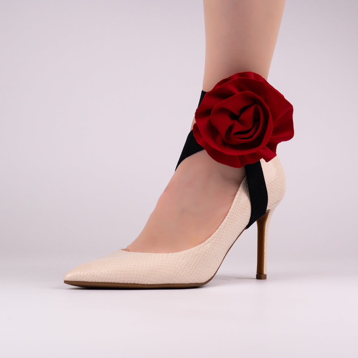 Red rose LYNKS straps styled on a white textured pump